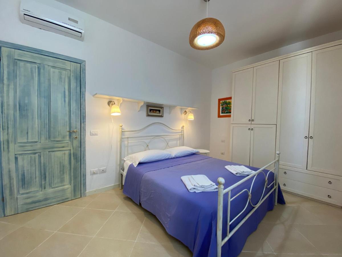 Sabrina Apartments Porto Pino Bagian luar foto