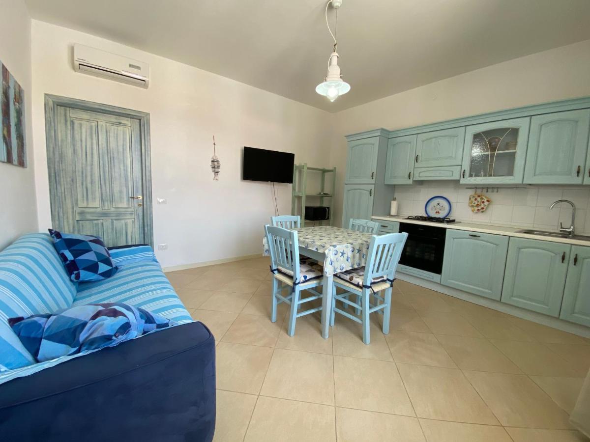 Sabrina Apartments Porto Pino Bagian luar foto